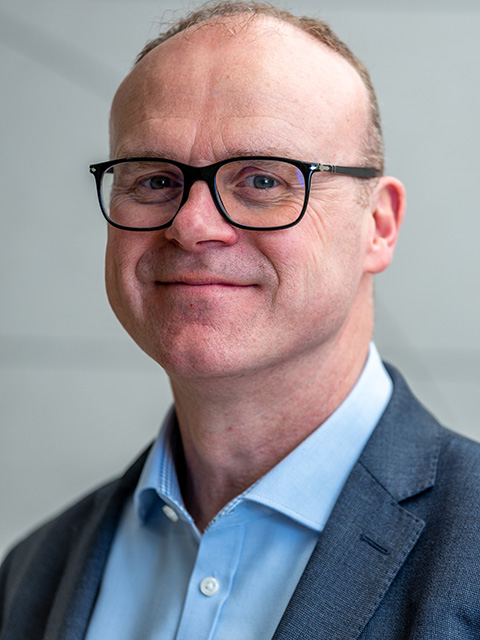 Portrait photograph of academic visitor to the School of Architecture, Building and Civil Engineering at Loughborough University, Peter Jones